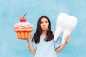 Concept image of woman wondering what to eat after dental implant surgery